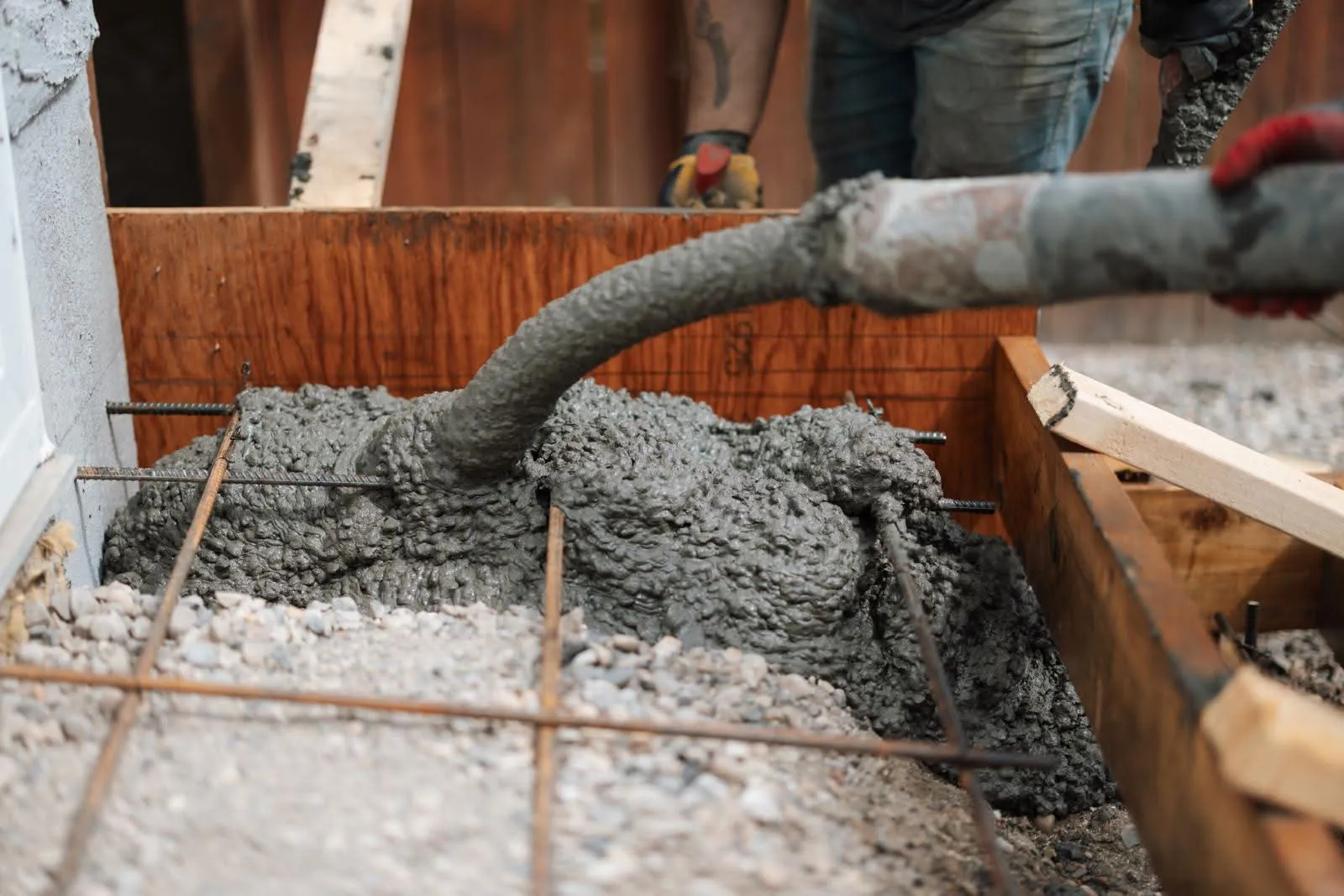 Licensed concrete contractor Calgary.professional crew finishing a residential concrete pour
